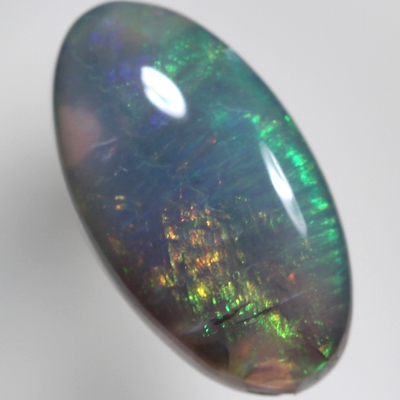 SOLID BLACK CRYSTAL OPAL Crisp green and orange with side flashes of red
